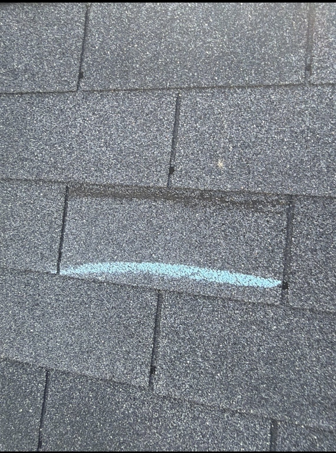 Close up roof shingle damage